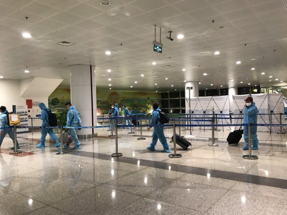 Passengers arrive at Noi Bai Airport. 