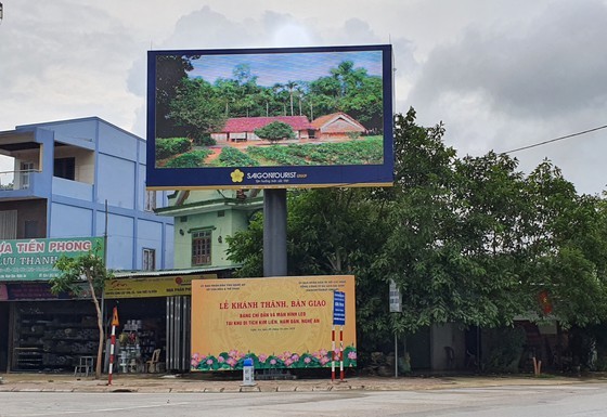 A big screen outdoor LED TV provides information of he birthplace of the late president Ho Chi Minh.