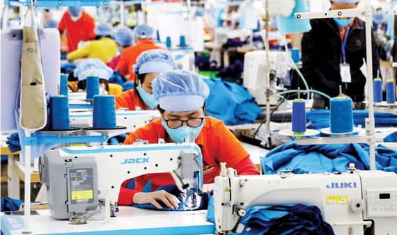 Việt Nam, thị trường đầu tư hấp dẫn Ngành dệt may Việt Nam đang hoạt động tốt. Ảnh: REUTERS