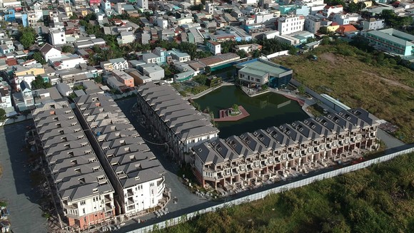 Tháo gỡ ách tắc hàng ngàn dự án bất động sản ảnh 1
