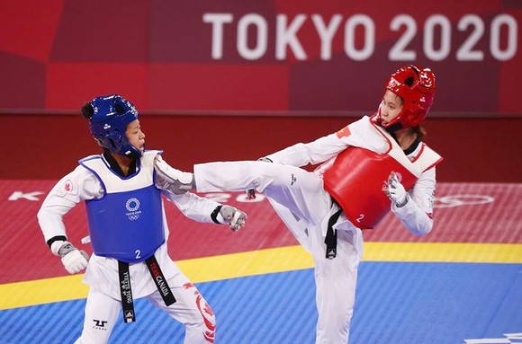 Võ sĩ Trương Thị Kim Tuyền thi đấu tại Olympic. Ảnh: REUTERS