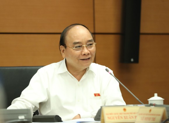 Chủ tịch nước Nguyễn Xuân Phúc: Đồng tình lùi thời điểm tăng lương cơ sở ảnh 2