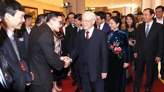 Party General Secretary Nguyen Phu Trong and overseas Vietnamese at Homeland Spring Program 2019 (Photo: VNA)