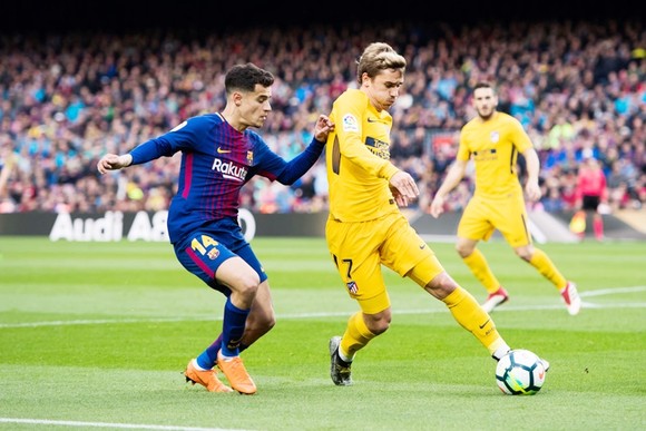 Barca đang làm mọi cách để có được Griezmann (vàng). Ảnh: Getty Images.