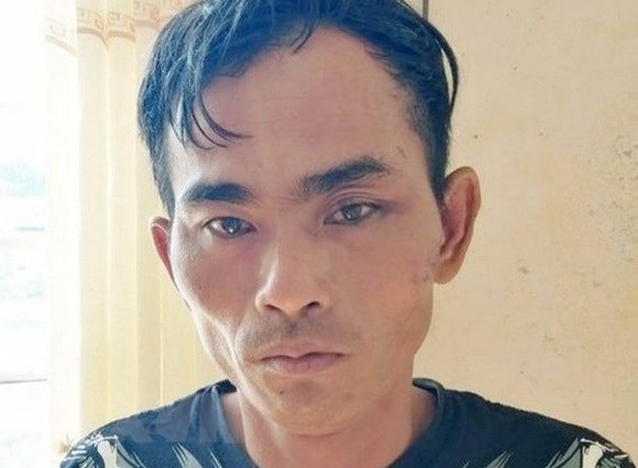 Đối tượng Huỳnh Hữu Lực bị tạm giữ hình sự tại Cơ quan Công an. Nguồn: TTXVN 