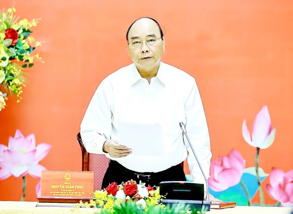 Chủ tịch nước Nguyễn Xuân Phúc phát biểu tại phiên họp thứ ba Hội đồng Quốc phòng và An ninh nhiệm kỳ 2016-2021. Ảnh: TTXVN