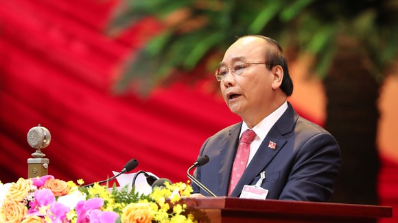 Thủ tướng Nguyễn Xuân Phúc trình bày diễn văn khai mạc Đại hội đại biểu toàn quốc lần thứ XIII của Đảng Cộng sản Việt Nam. Ảnh: VIẾT CHUNG