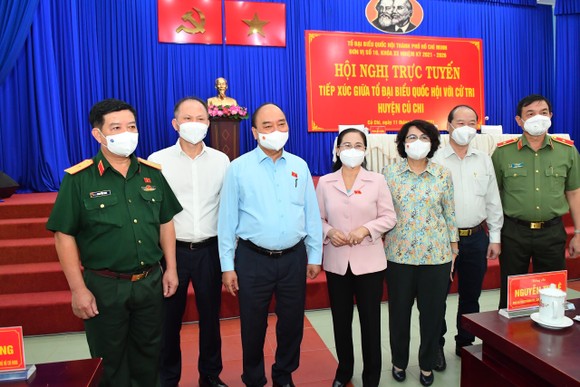 Chủ tịch nước Nguyễn Xuân Phúc gợi mở cách kiểm soát dịch và phát triển kinh tế cho TPHCM ảnh 5