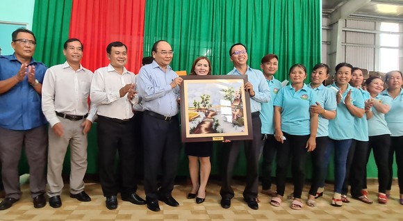 Chủ tịch nước Nguyễn Xuân Phúc: Tiền Giang có đầy đủ điều kiện để phát triển HTX kiểu mới, kiểu mẫu ảnh 4