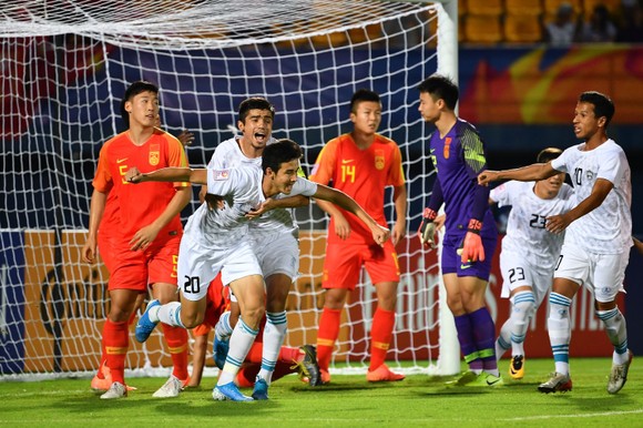 ĐKVĐ Uzbekistan trong trận thắng Trung Quốc ở vòng bảng.,Ảnh: AFC