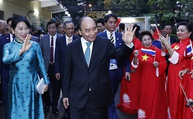 President visits Vietnamese in Thailand ảnh 1