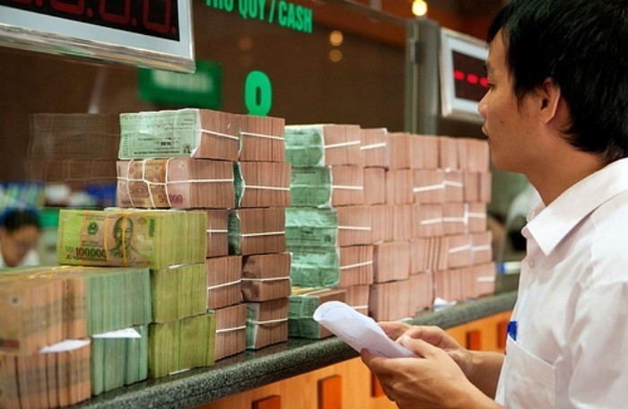 Ngân hàng bắt đầu giảm lãi suất cho vay cứu doanh nghiệp ảnh 1